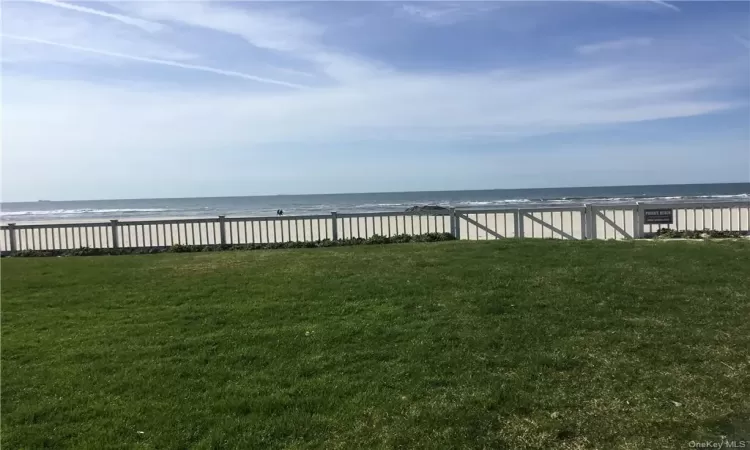 View of yard with a water view