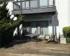 Property entrance featuring a deck and a balcony