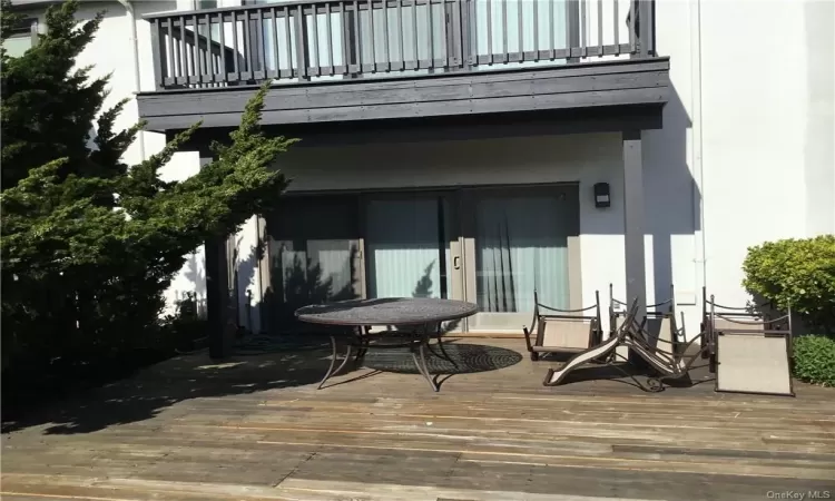 Property entrance featuring a deck and a balcony