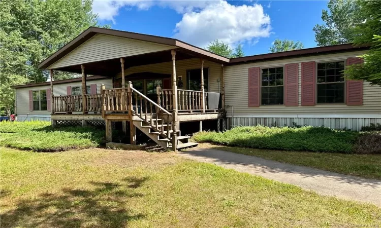 View of front of property with a front lawn