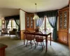 Dining space featuring a textured ceiling and carpet floors