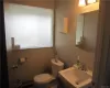 Bathroom with sink and toilet