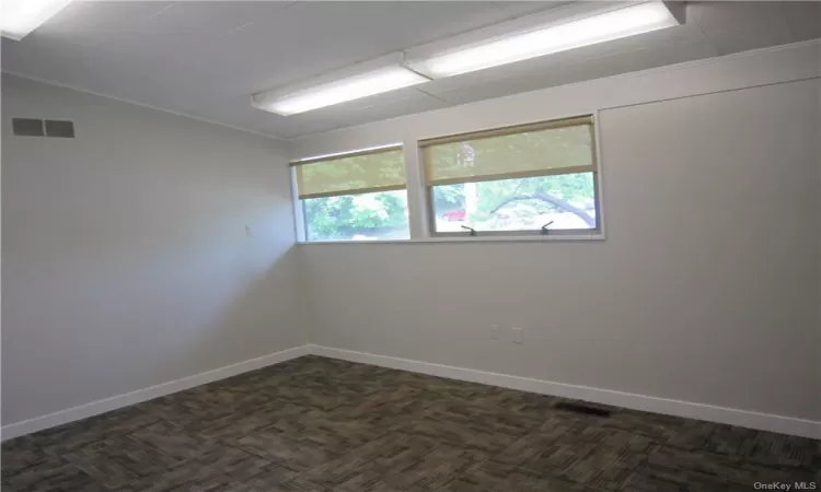 Empty room with dark carpet