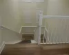 Staircase with hardwood / wood-style flooring