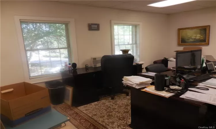 Home office featuring a paneled ceiling