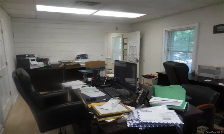 Home office featuring a drop ceiling