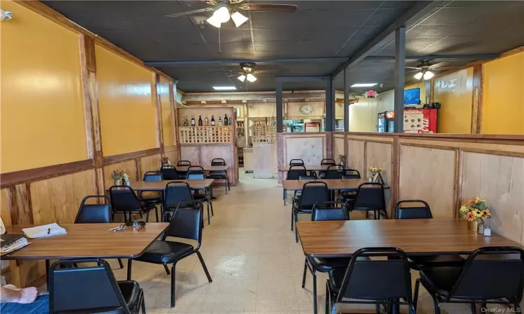 Tiled dining area with ceiling fan