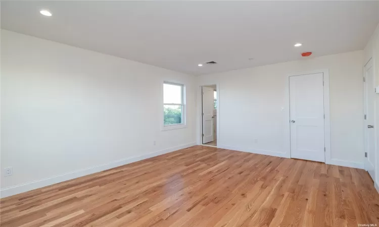 Bedroom with hard wood floor