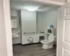 Bathroom featuring sink, hardwood / wood-style flooring, and toilet