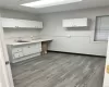 Kitchen featuring white cabinetry, sink, and dark hardwood / wood-style flooring