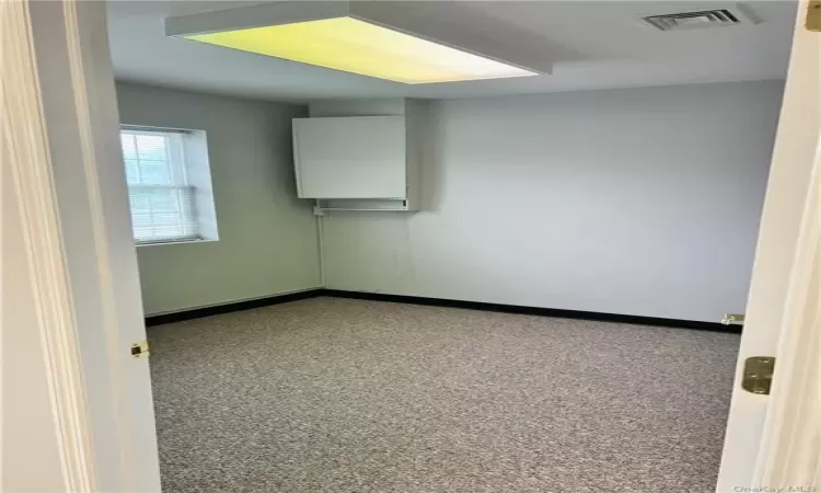 Empty room featuring carpet floors