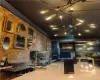 Kitchen featuring ornamental molding and brick wall