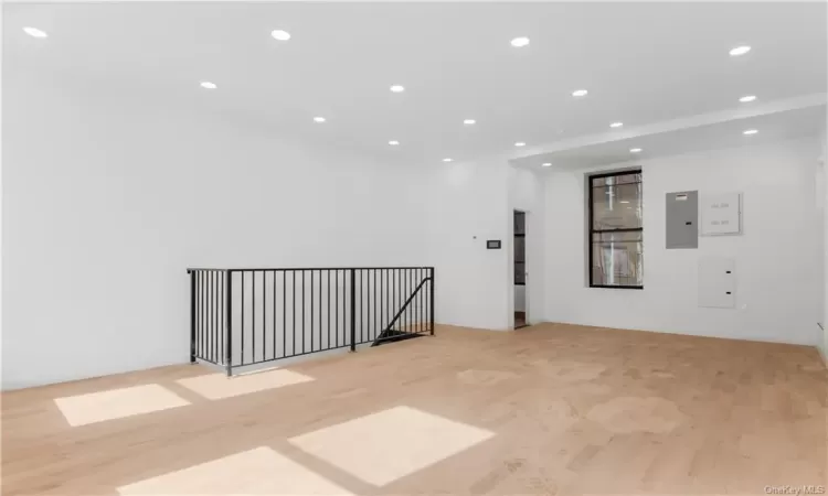 Unfurnished room with light hardwood / wood-style floors