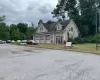 View of front of property with a garage and a front yard