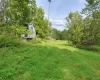 View of yard with a storage shed