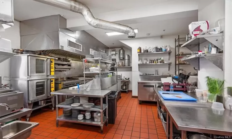 Kitchen with stainless steel counters and tile flooring