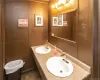 Bathroom with tile patterned floors and double sink vanity