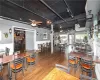 Dining room featuring ceiling fan, track lighting, and hardwood / wood-style floors