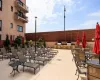 Pool Deck with Lounge Chairs and Tables with Umbrellas