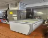 Kitchen with tile patterned flooring, washer / dryer, and a drop ceiling