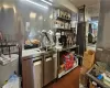 Kitchen with a drop ceiling, water heater, and dark tile patterned floors