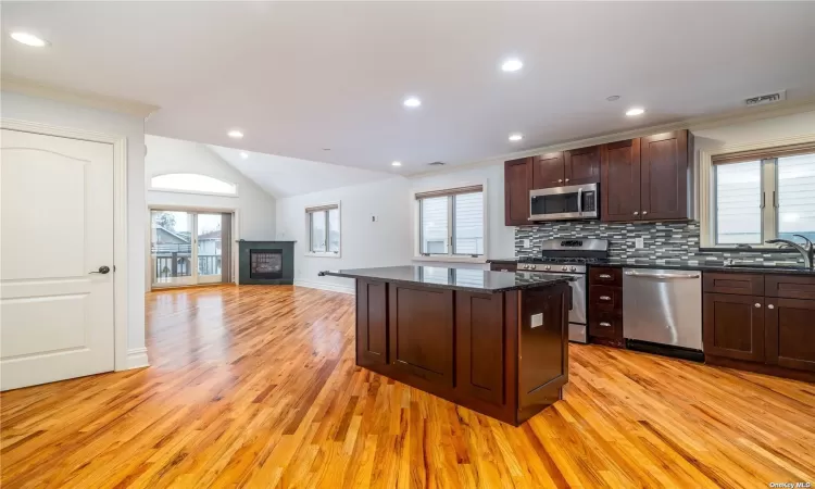 Open Kitchen to Living Room with Sliders to balcony