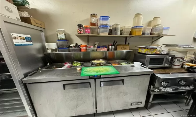 Kitchen with light tile patterned floors