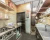 Kitchen with stainless steel stove and stainless steel counters