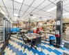 Dining space featuring a drop ceiling and tile patterned flooring