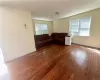 1st Floor - Unfurnished living room with dark hardwood / wood-style flooring