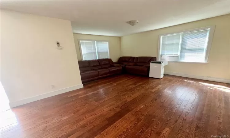 1st Floor - Unfurnished living room with dark hardwood / wood-style flooring