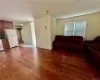 1st Floor - Living room with open concept kitchen  featuring hardwood / wood-style floors