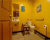 Bathroom featuring tile patterned flooring and toilet