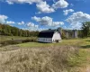 View of outbuilding featuring a water view