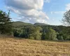 View of mountain feature with a rural view