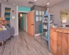 Home office with a paneled ceiling and light hardwood / wood-style floors