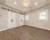 Primary Bdrm w/Trey Ceiling & Barn Door closets