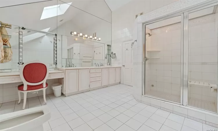 PRIMARY BATHROOM WITH TWO SINKS AND SHOWER