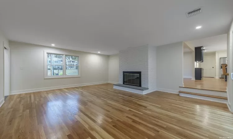 Family room with wood burning fireplace