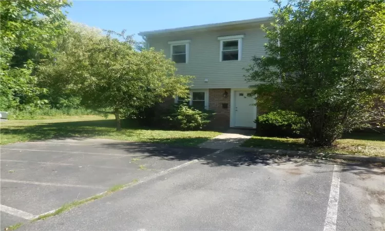 View of front of property featuring a front yard