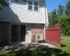 Rear view of house featuring a patio area and a yard