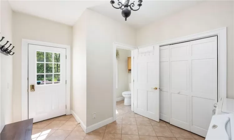 Dining area with a baseboard radiator, indoor bar, and dark wood-type flooring