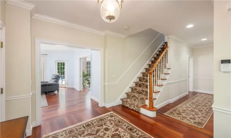 Bedroom with light carpet, a closet, and ceiling fan