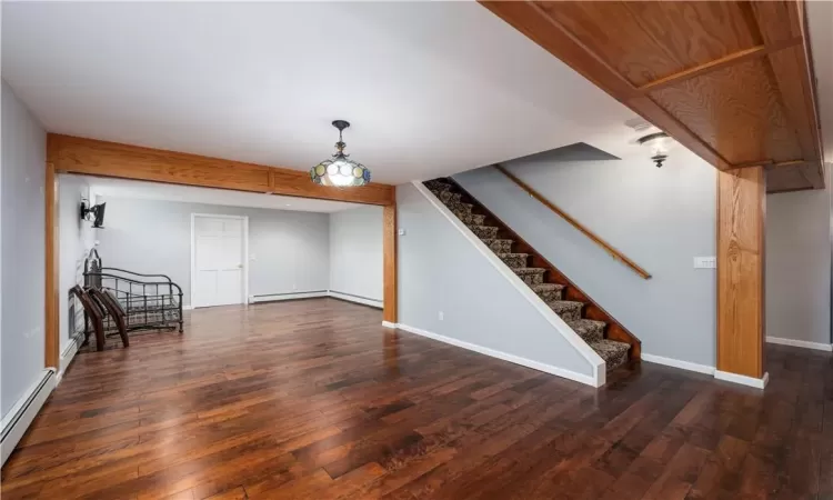 Laundry area featuring an inviting chandelier, washer and clothes dryer, and light tile patterned floors