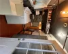 Laundry room featuring sink, dark wood-type flooring, and washing machine and dryer