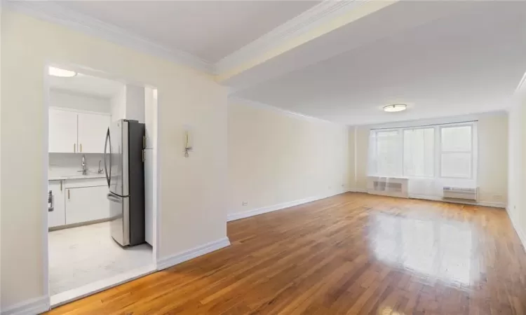 Unfurnished living room with wood flooring