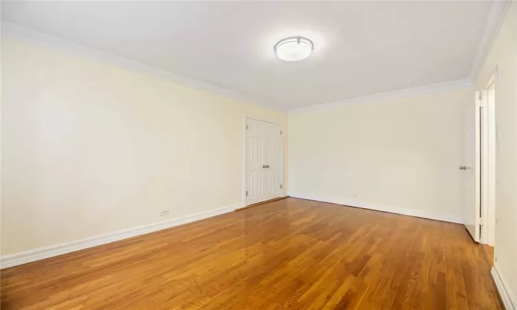 Unfurnished bedroom, hardwood floors