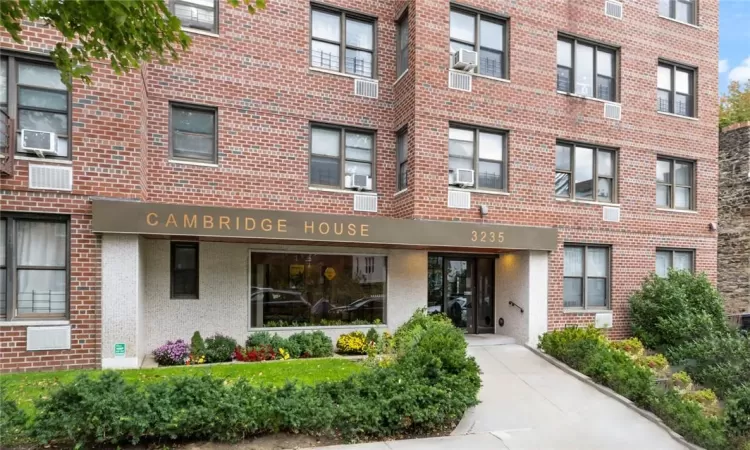 View of building exterior featuring cooling unit