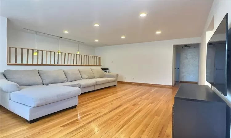 Unfurnished living room featuring light hardwood / wood-style floors