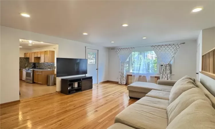 Living room with light wood-type flooring